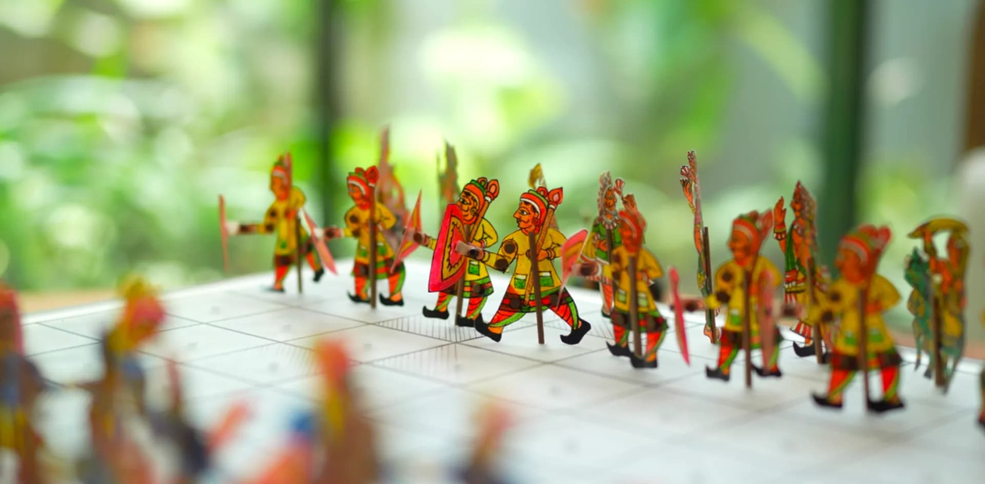 Traditional painted leather puppets arranged on a table