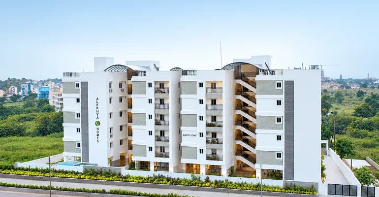 Earth Song residences framed by hillside greenery